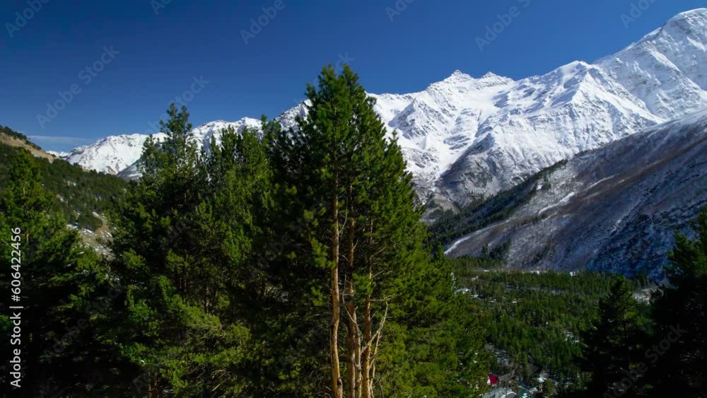 A beautiful panorama of the snowy peaks in a picturesque gorge. Landscape and nature of the North Caucasus A beautiful panorama of the snowy peaks in a picturesque gorge. Landscape and nature of the North Caucasus
