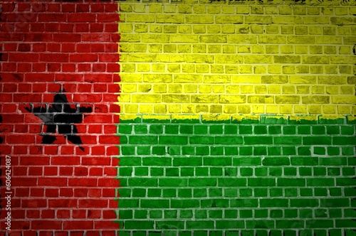 Shot of the Guinea-Bissau flag painted on a brick wall in an urban location