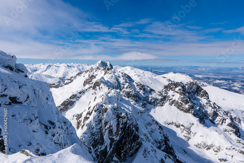 Beautiful winter scenery of Swinica and Beskid Peak from Kozi Wierch Peak in Tatras Mountains  famous place in Tatras with chalet. Poland. Tatra National Park