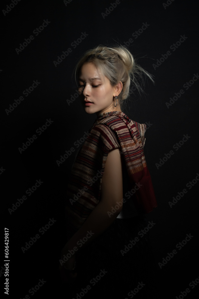 Naklejka premium Beautiful girl in Thailand costume,Asian woman wearing traditional Thailand culture at studio.Vintage style.