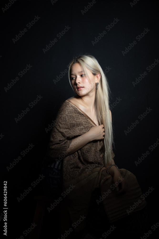 Beautiful girl in Thailand costume,Asian woman wearing traditional Thailand culture at studio.Vintage style. Beautiful girl in Thailand costume,Asian woman wearing traditional Thailand culture at studio.Vintage style.