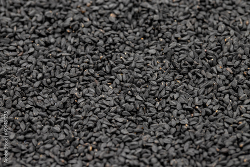 Pile of black cumin as background, spice or seasoning as background. Kalonji, nigella sativa, black cumin