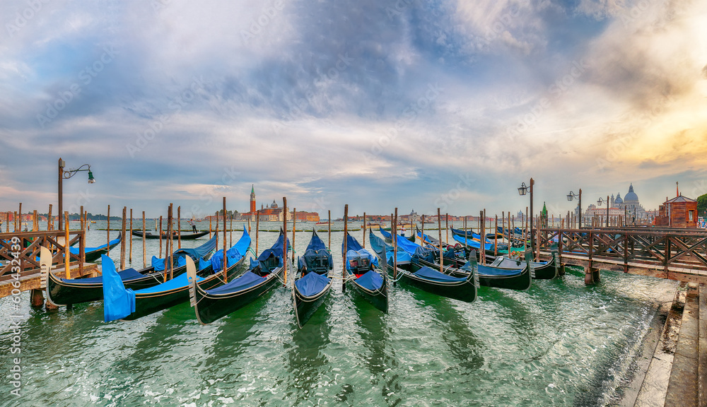 Captivating  landscape with Church of San Giorgio Maggiore on background and gondolas parked beside the Riva degli Schiavoni in Venice