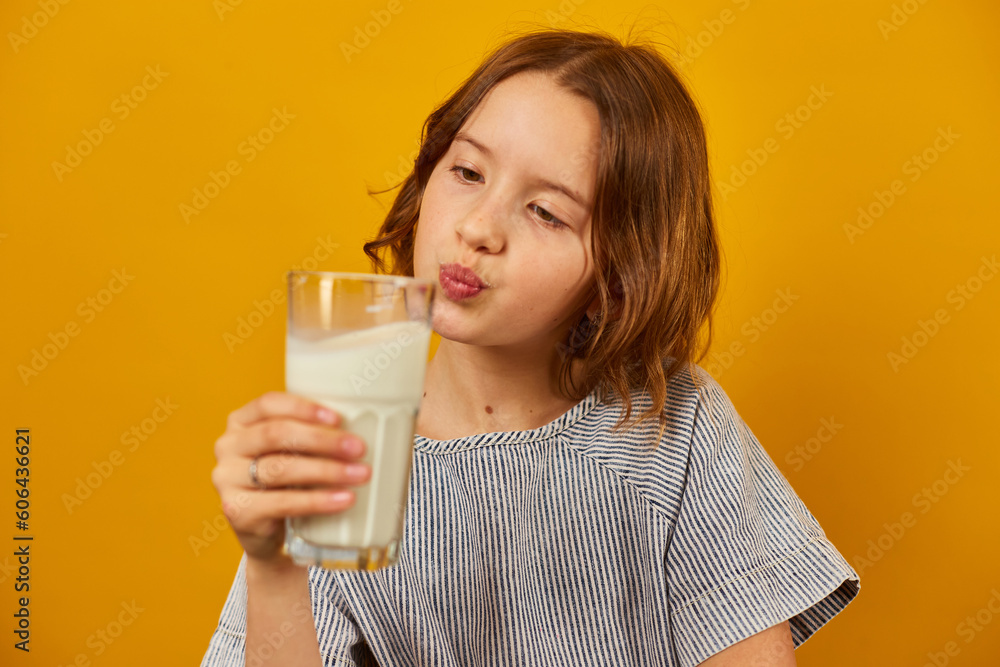 Pretty teen girl, child with a fresh glass of milk Pretty teen girl, child with a fresh glass of milk
