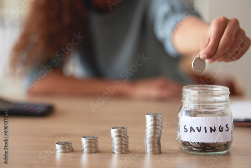 Obraz na plátně Hand, savings jar and money with finance and budget, future financial planning with investment and coins on a table