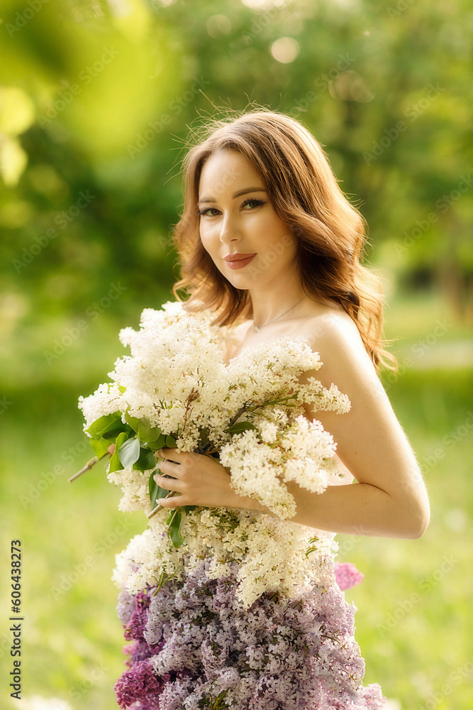 portrait of a girl in a lilac dress lying on the grass, taken at sunset portrait of a girl in a lilac dress lying on the grass, taken at sunset