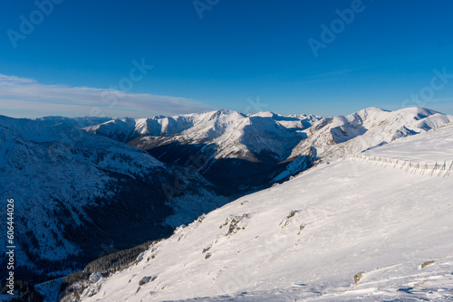 Beautiful winter scenery of Swinica and Beskid Peak from Kasprowy Wierch Peak in Tatras Mountains, famous place in Tatras with cable railway. Poland. Tatra National Park © Martin