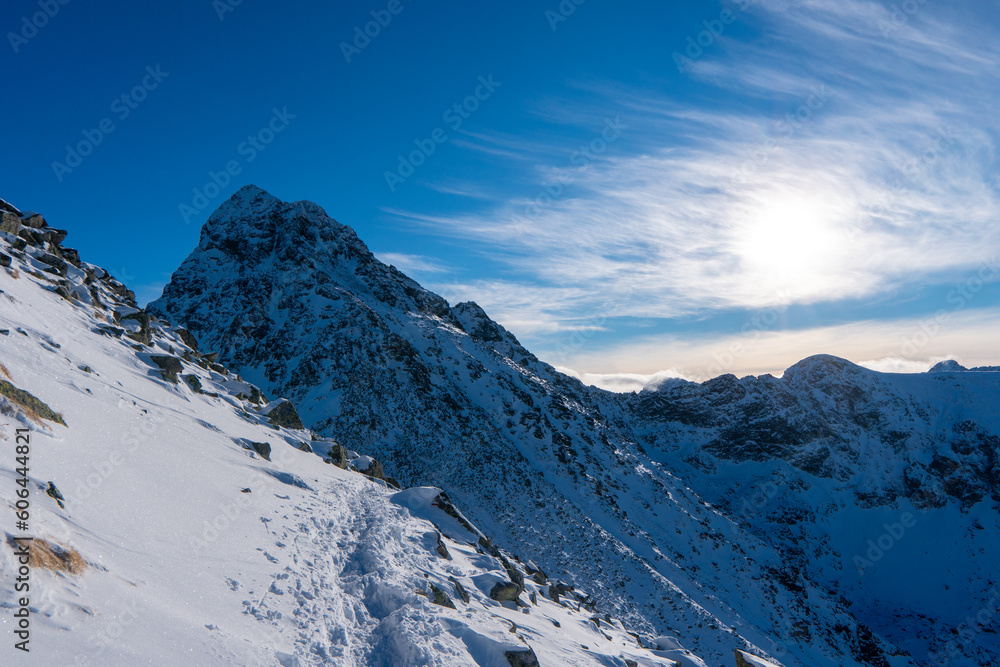 Fototapeta premium Beautiful winter scenery of Swinica and Beskid Peak from Kasprowy Wierch Peak in Tatras Mountains, famous place in Tatras with cable railway. Poland. Tatra National Park