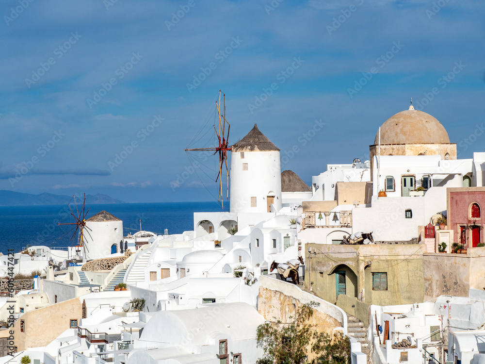 Stair stepped buildings and windmills of Santorini.