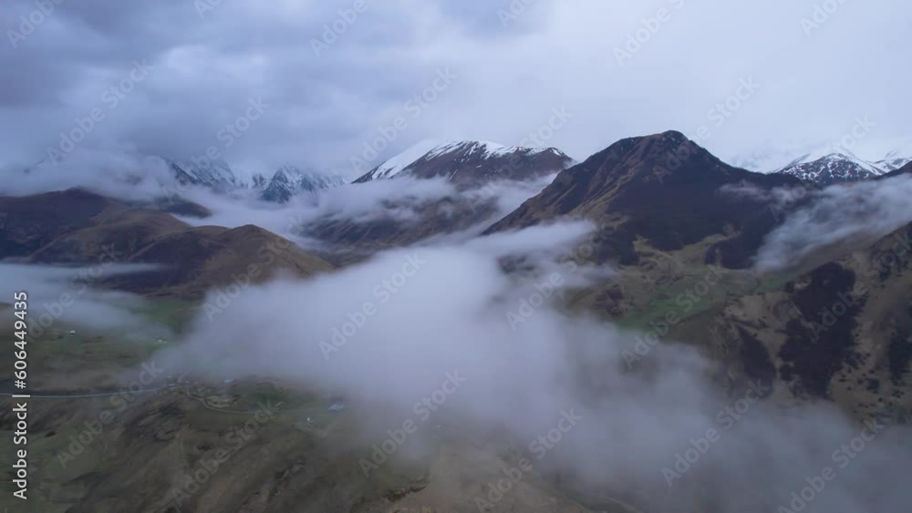 Low clouds in the mountains. Aerial view of low fog in mountainous area Low clouds in the mountains. Aerial view of low fog in mountainous area