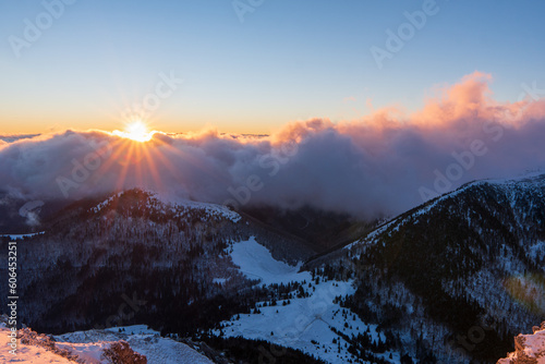 beautiful red sunset in winter mountain in Rozsutec peak in Small Fatra mountain in Slovakia