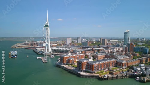 Drone aerial footage of spinning around Spinnaker Tower and Portsmouth Harbour. Portsmouth is a port city and unitary authority in Hampshire, England. photo