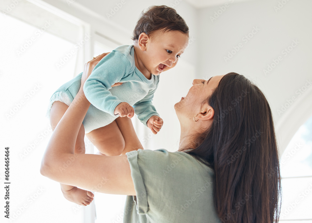 Foto Mother holding laughing baby in home for love, care and quality time together to nurture childhood development