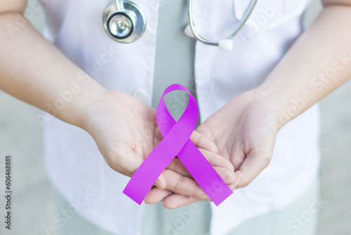 Картината върху платно Purple awareness of ribbon in doctor hand for Cancer, ADD,ADHD,Alzheimer's Disea