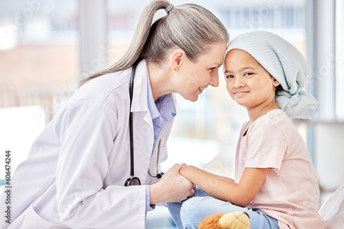 Smile, pediatrician and child holding hands on bed in hospital for children, health and support in cancer treatment. Pediatrics, healthcare and happy kid, doctor with young patient for health care.