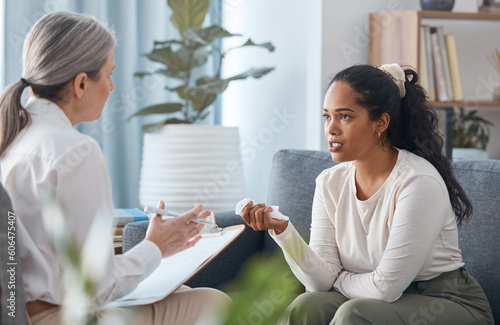Psychologist, therapy and woman talking in consultation for mental health in office. Therapist, psychology and female patient consulting, counseling and discussion for depression, stress and crying. photo