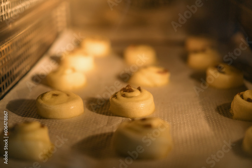 Lush, crispy fragrant buns are baked in the oven in the bakery Puff pastry and flour products production