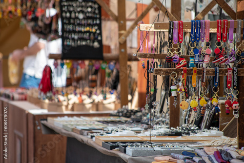 Costume jewellery in a medieval market. Fashion accessories for women. Fashionable necklaces, bracelets, rings, earrings, key chains. Amulets and spiritual. Jewels sale for purchase. Marketplace.