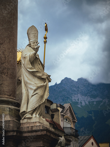 Statue of Saint Vigilius on St. Anne's column in Innsbruck, Tyrol, Austria photo