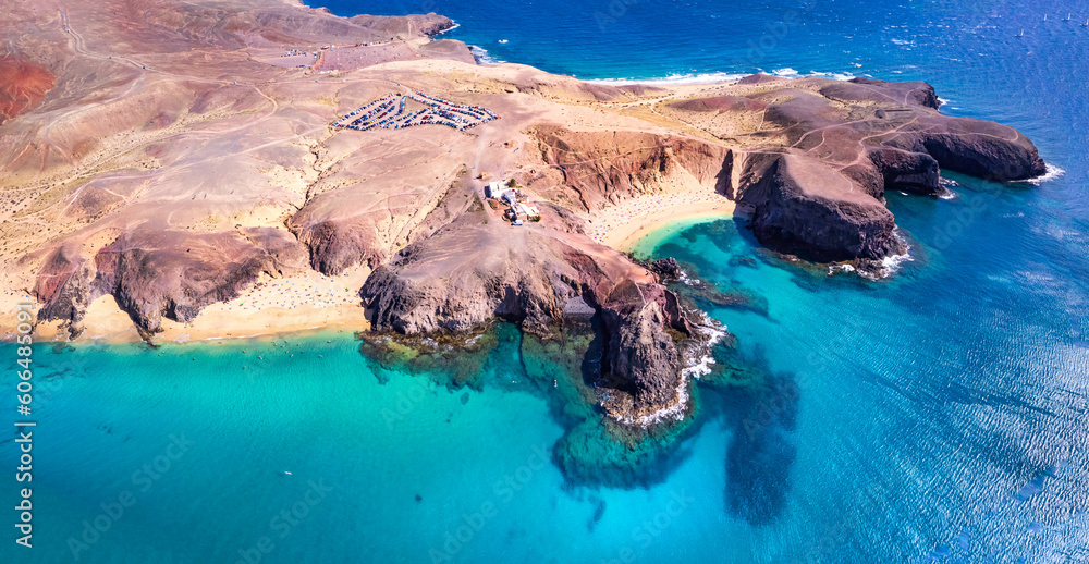 Lanzarorote Canary islands beach scenery. Aerial drone panoramic high angle view of popular scenic Papagayo beach in the south.
