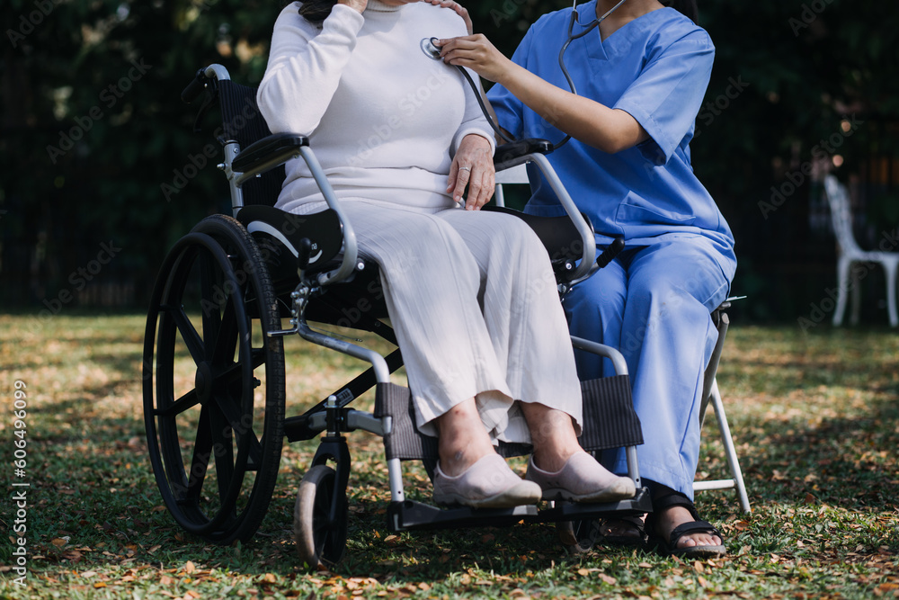 Fototapeta premium young asian physical therapist working with senior woman on walking with a walker