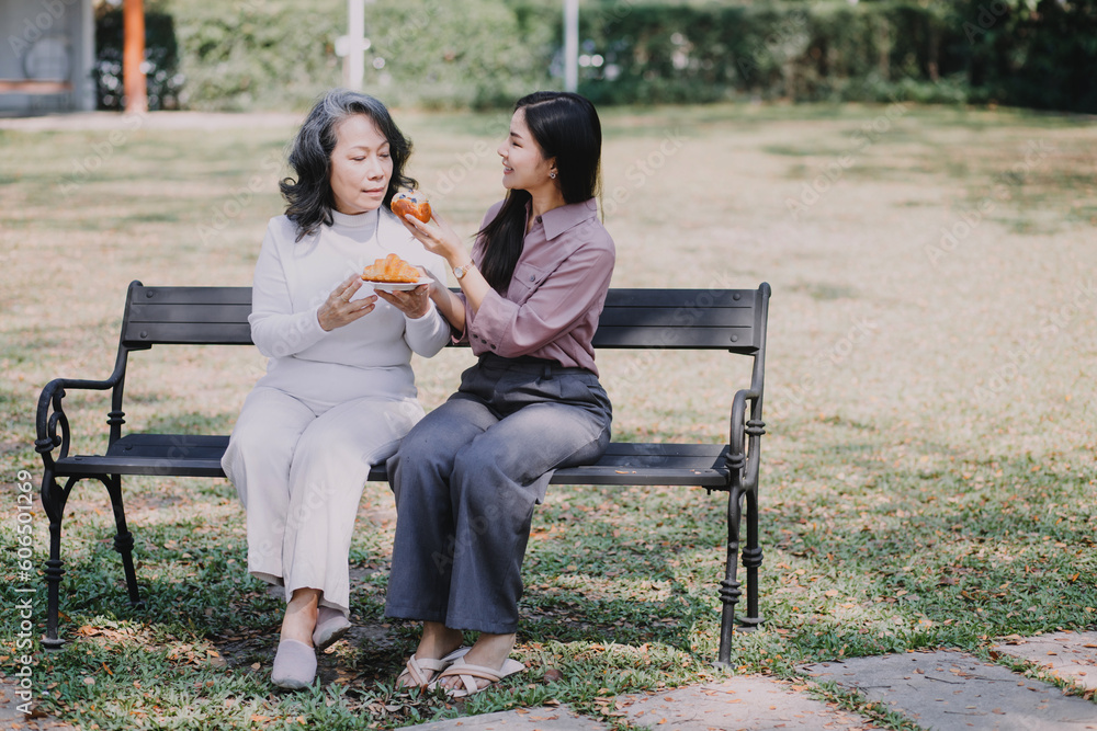 Happy senior woman enjoying in daughter's affection on Mother's day.