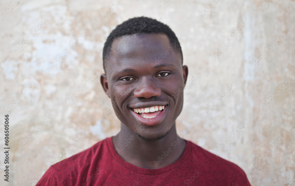 portrait of a young smiling black man portrait of a young smiling black man