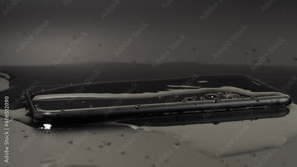 Water has been spilled on the Smartphone. The smartphone fell into the water. Water drips on the smartphone. Water has been spilled on the Smartphone. The smartphone fell into the water. Water drips on the smartphone.