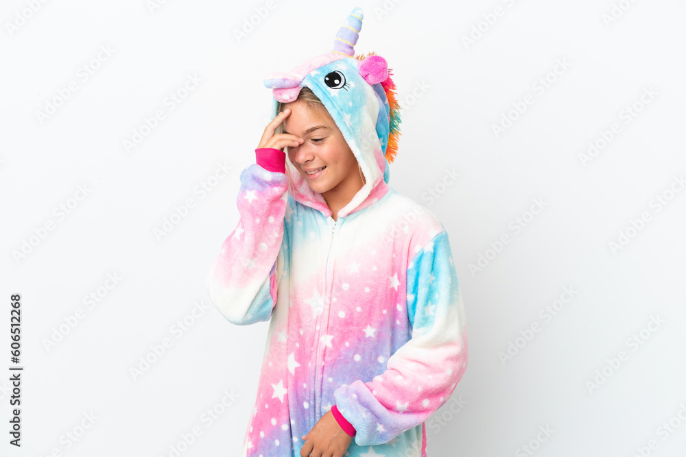Little girl with unicorn pajamas isolated on white background laughing Little girl with unicorn pajamas isolated on white background laughing