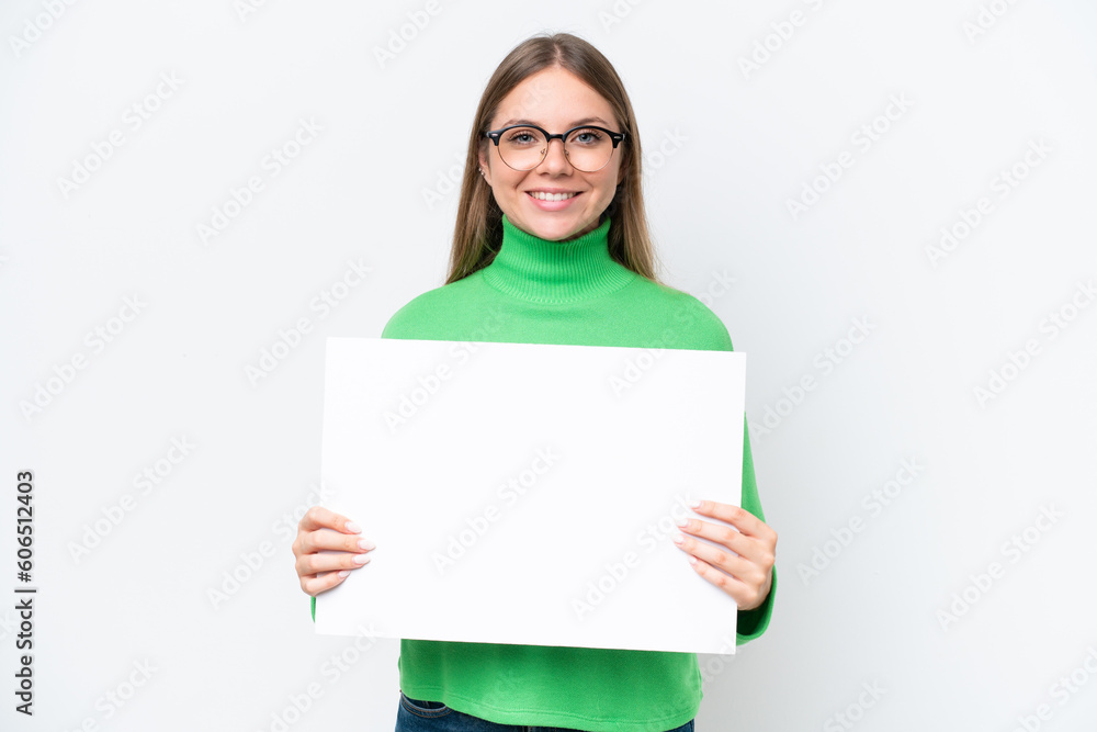 Young caucasian woman isolated on white background holding an empty placard with happy expression Young caucasian woman isolated on white background holding an empty placard with happy expression