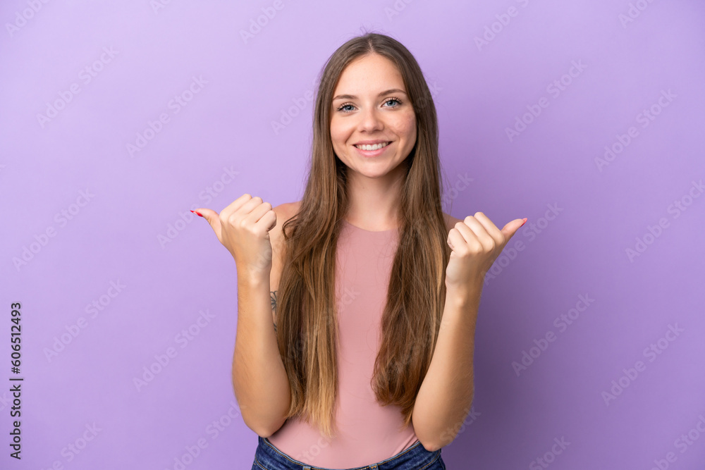 Young Lithuanian woman isolated on purple background with thumbs up gesture and smiling Young Lithuanian woman isolated on purple background with thumbs up gesture and smiling