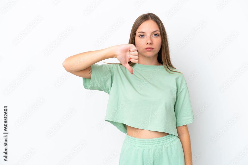 Young Lithuanian woman isolated on white background showing thumb down with negative expression Young Lithuanian woman isolated on white background showing thumb down with negative expression
