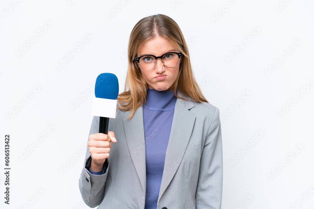 Young TV presenter caucasian woman isolated on white background with sad expression Young TV presenter caucasian woman isolated on white background with sad expression