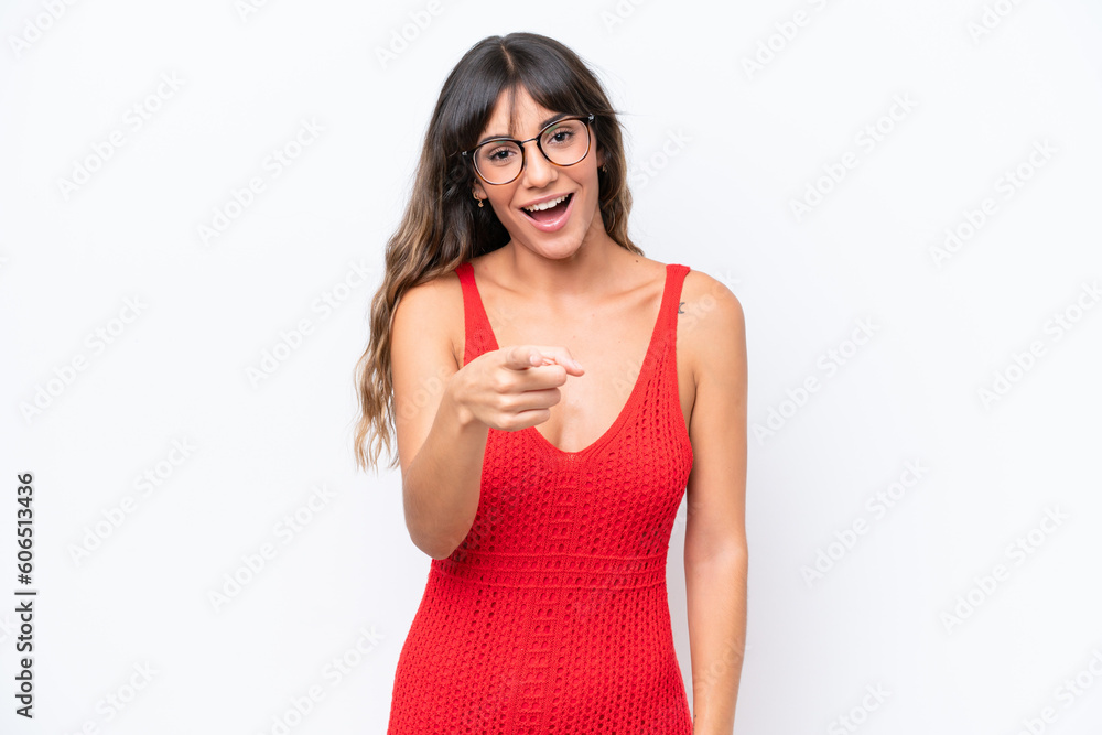 Young caucasian woman isolated on white background surprised and pointing front Young caucasian woman isolated on white background surprised and pointing front