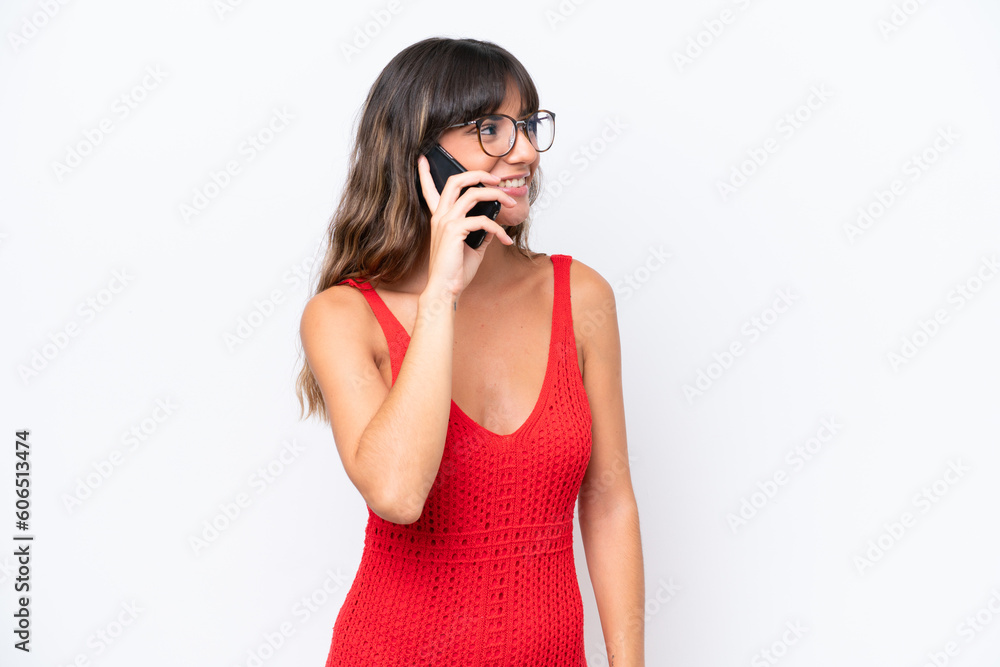 Young caucasian woman isolated on white background keeping a conversation with the mobile phone with someone Young caucasian woman isolated on white background keeping a conversation with the mobile phone with someone