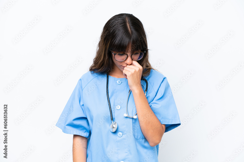 Young caucasian nurse woman isolated on white background having doubts Young caucasian nurse woman isolated on white background having doubts