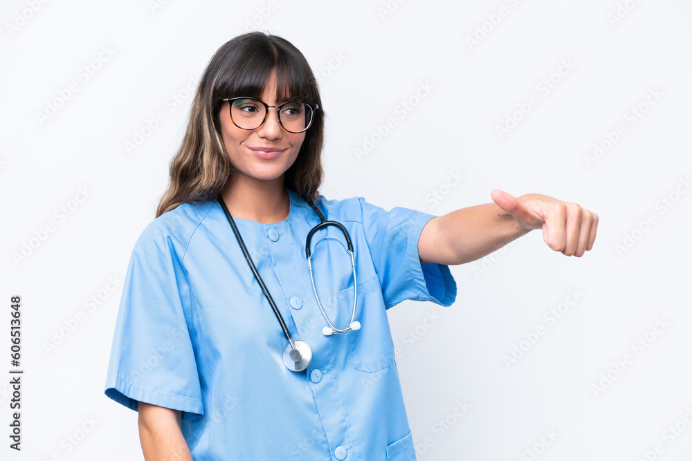 Young caucasian nurse woman isolated on white background giving a thumbs up gesture Young caucasian nurse woman isolated on white background giving a thumbs up gesture