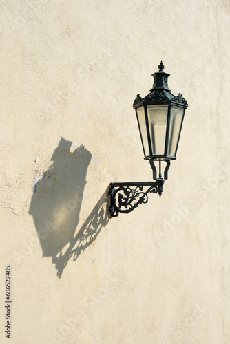 historical lamp with a shadow on the wall.