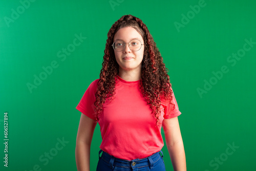Teenager with red curly hair, wearing jeans, shirt, glasses and with various facial expressions of feelings © Eugenio
