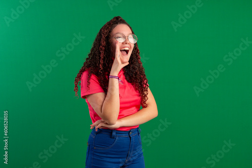 Teenager with red curly hair, wearing jeans, shirt, glasses and with various facial expressions of feelings