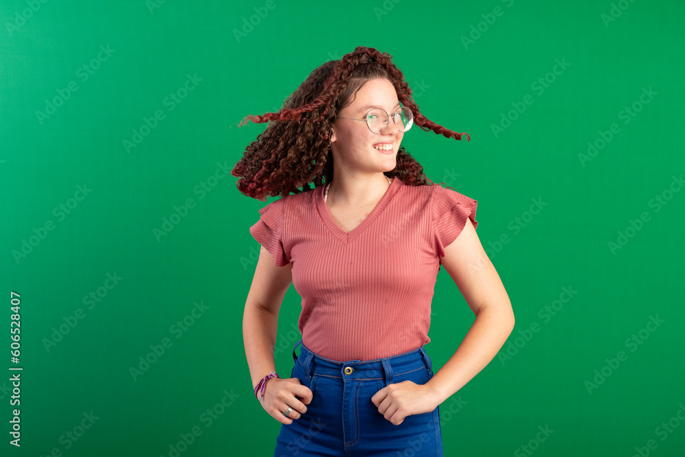 Teenager with red curly hair, wearing jeans, shirt, glasses and with various facial expressions of feelings Teenager with red curly hair, wearing jeans, shirt, glasses and with various facial expressions of feelings