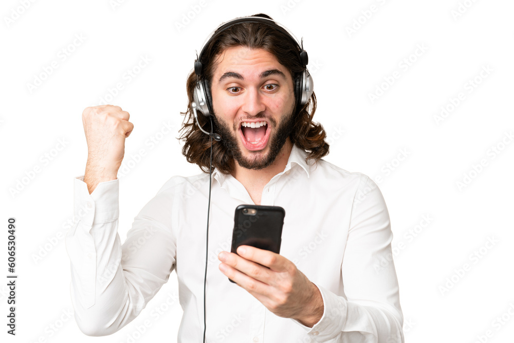 Telemarketer man working with a headset over isolated chroma key background surprised and sending a message Telemarketer man working with a headset over isolated chroma key background surprised and sending a message