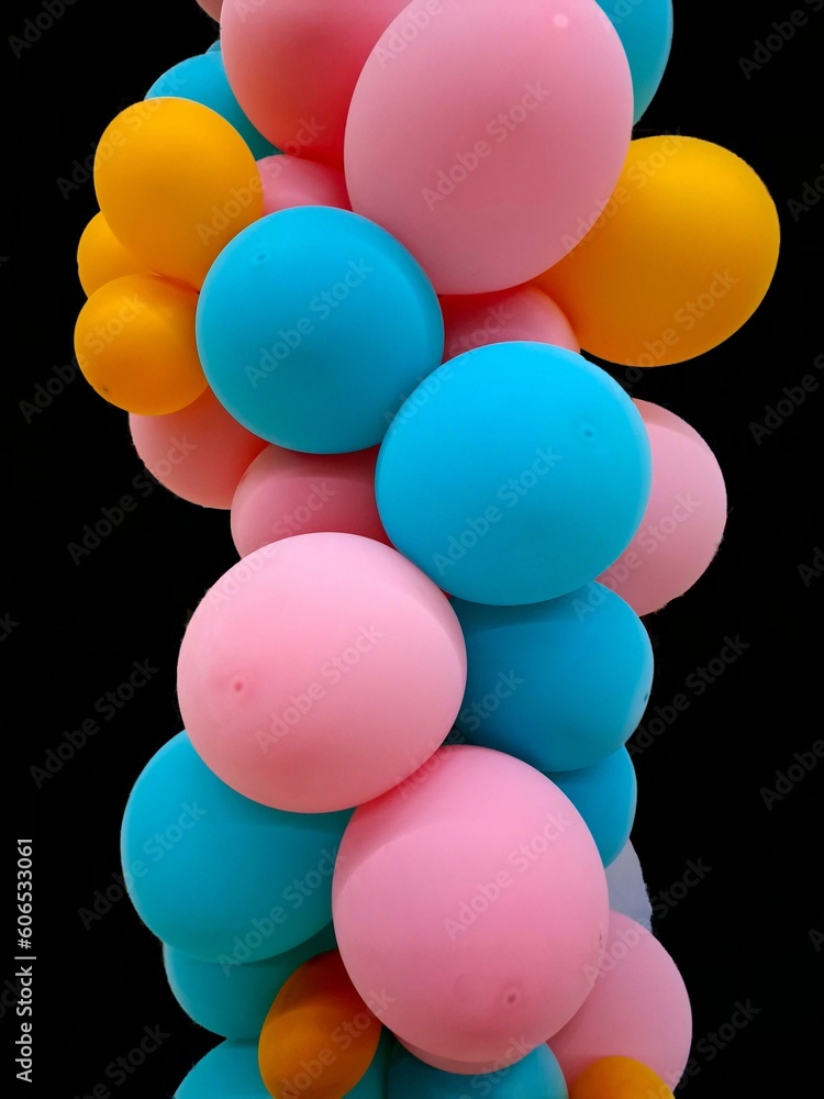 inflatable colored balls on a black background inflatable colored balls on a black background