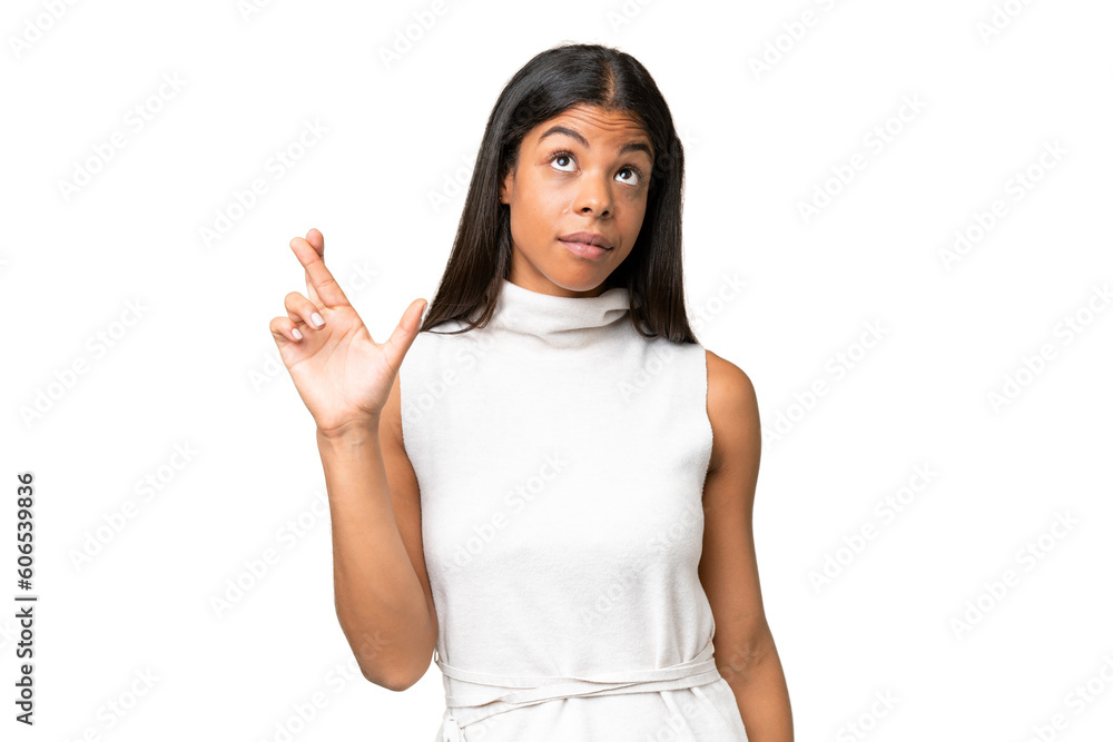 Young African american woman over isolated background with fingers crossing and wishing the best Young African american woman over isolated background with fingers crossing and wishing the best
