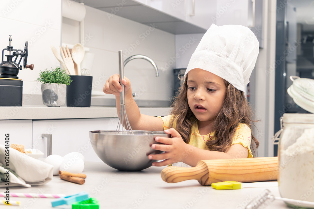 Baking Magic: Girl Transforming Ingredients into Tempting Pastries in the Kitchen Baking Magic: Girl Transforming Ingredients into Tempting Pastries in the Kitchen