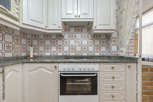 A fitted kitchen with a polished granite