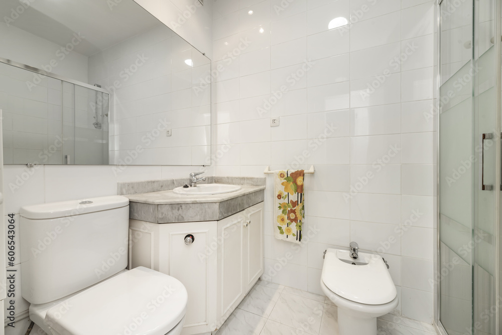 A sink with a sink embedded in a gray marble countertop A sink with a sink embedded in a gray marble countertop