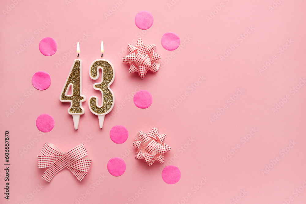 Number 43 on a pastel pink background with festive decor. Happy birthday candles. The concept of celebrating a birthday, anniversary, important date, holiday. Copy space. Banner Number 43 on a pastel pink background with festive decor. Happy birthday candles. The concept of celebrating a birthday, anniversary, important date, holiday. Copy space. Banner