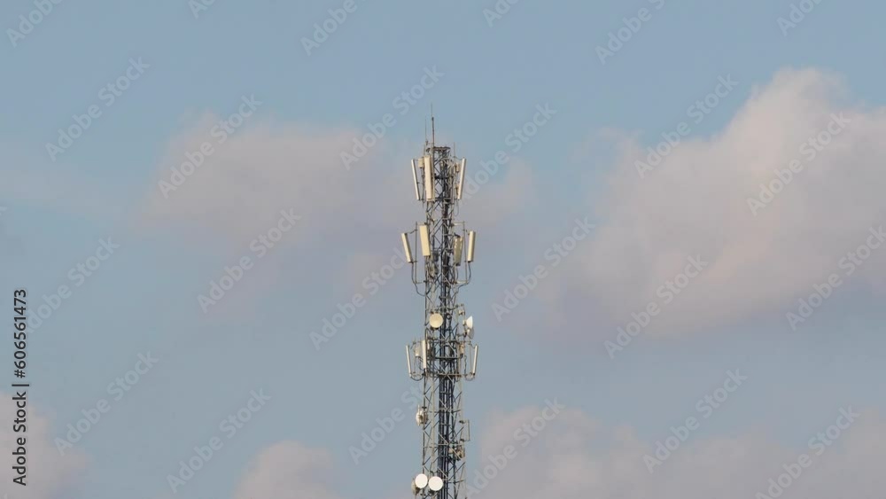Time lapse video of a communication tower and moving clouds on the background Time lapse video of a communication tower and moving clouds on the background