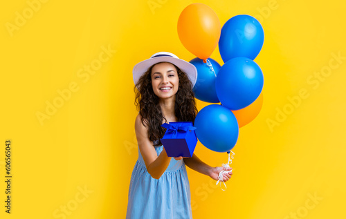 happy birthday woman with gift balloons isolated on yellow. birthday woman © be free